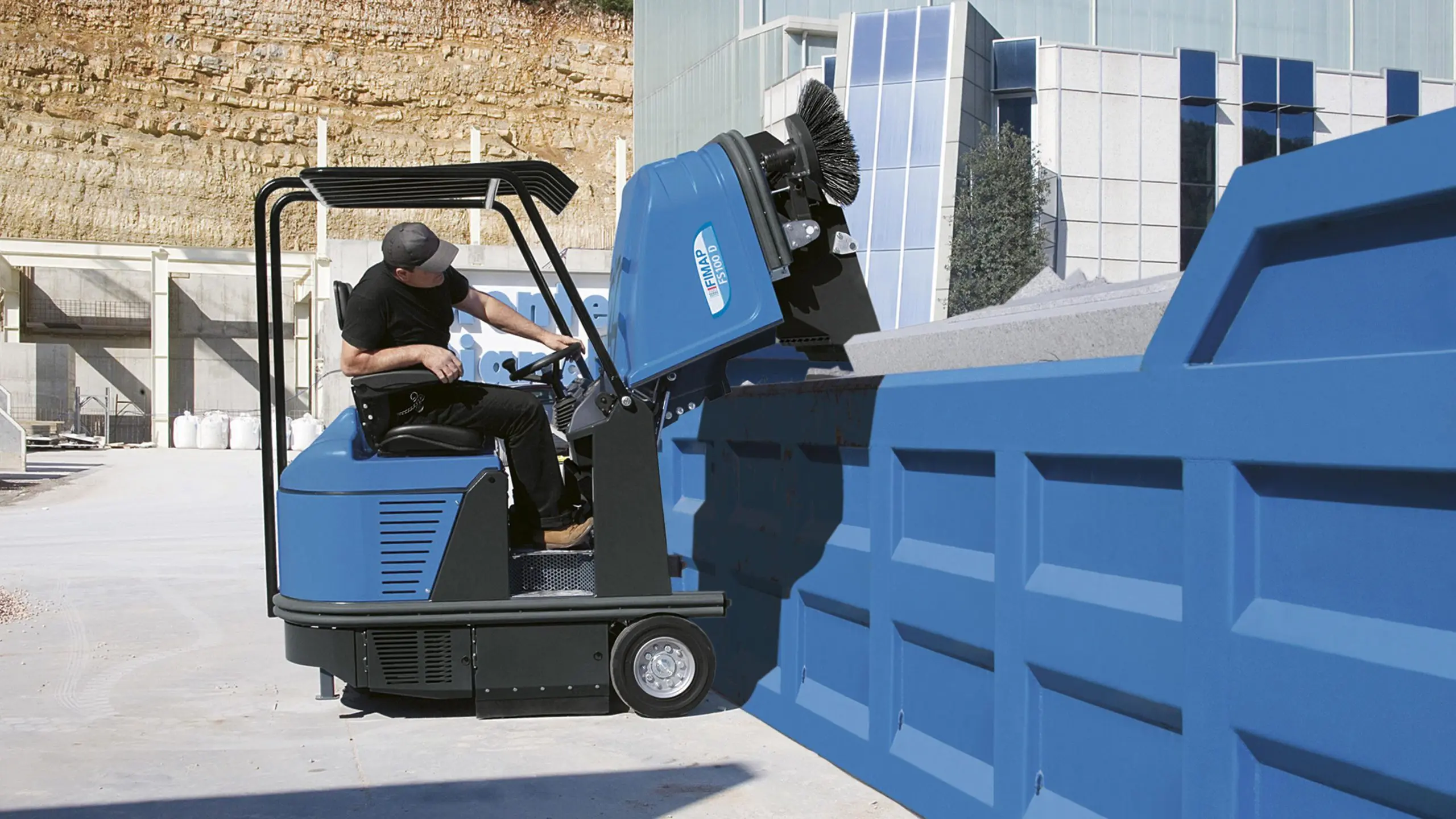 Filtered machine sweeping controlling dust on a factory floor