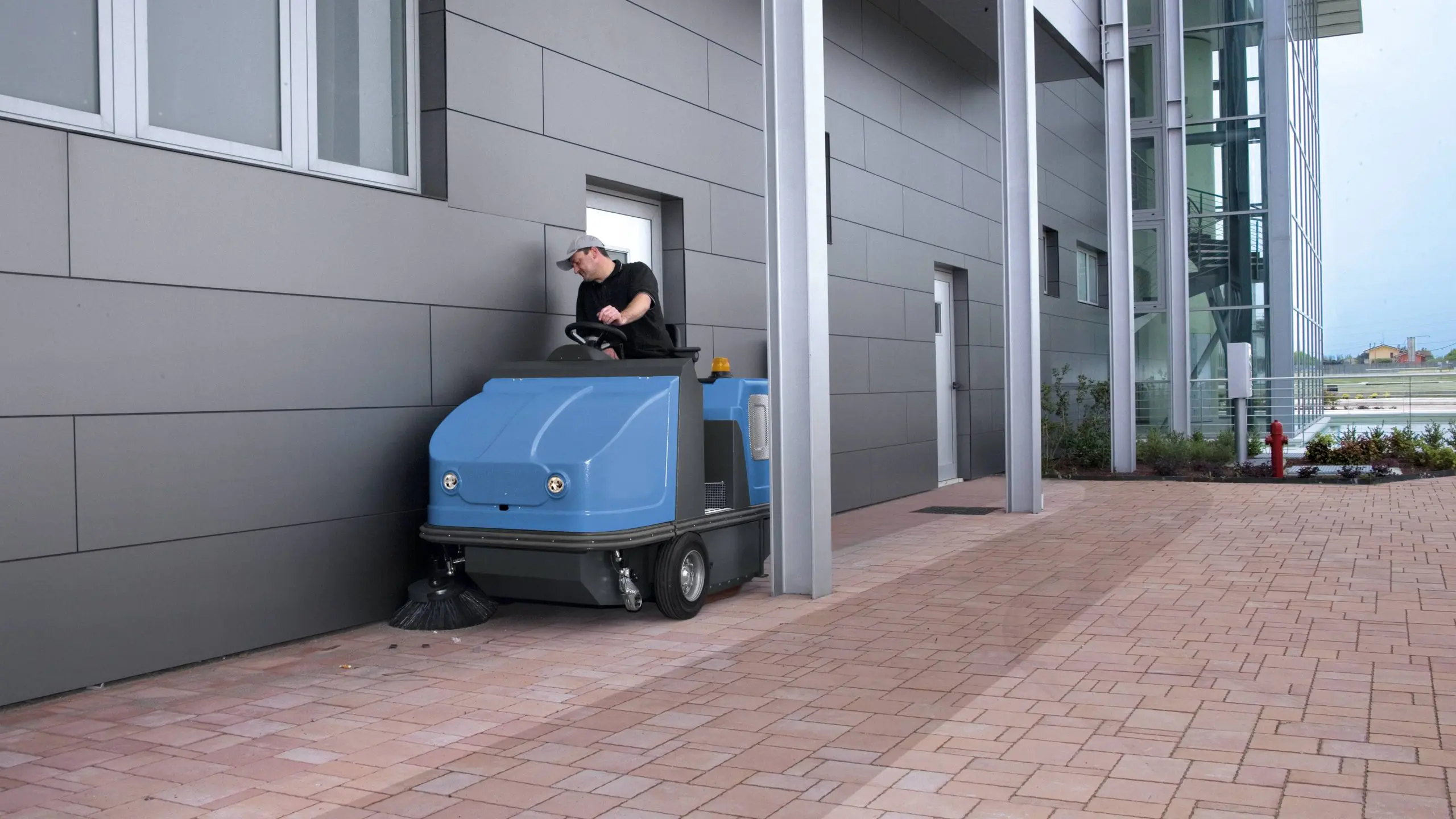 Contract Sweeping ride-on sweeper working a commercial site in South East Queensland