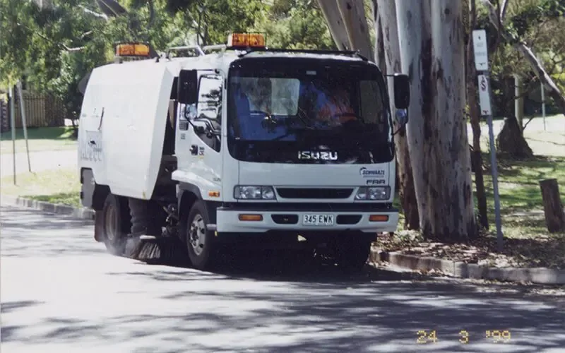 Contract Sweeping truck-mounted street sweeper working a Brisbane street